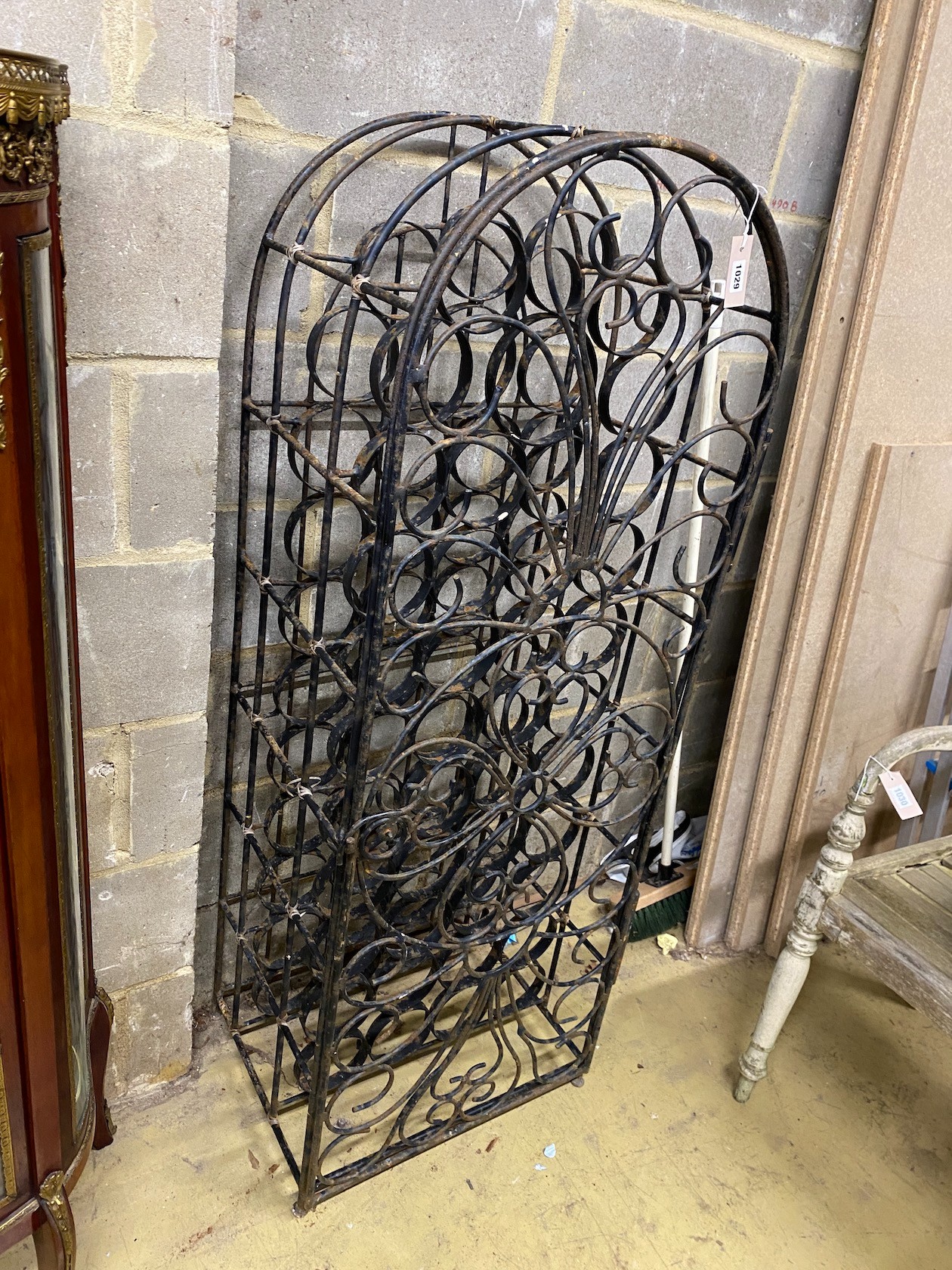 A painted wrought iron 44 bottle wine cage, width 52cm, depth 40cm, height 142cm